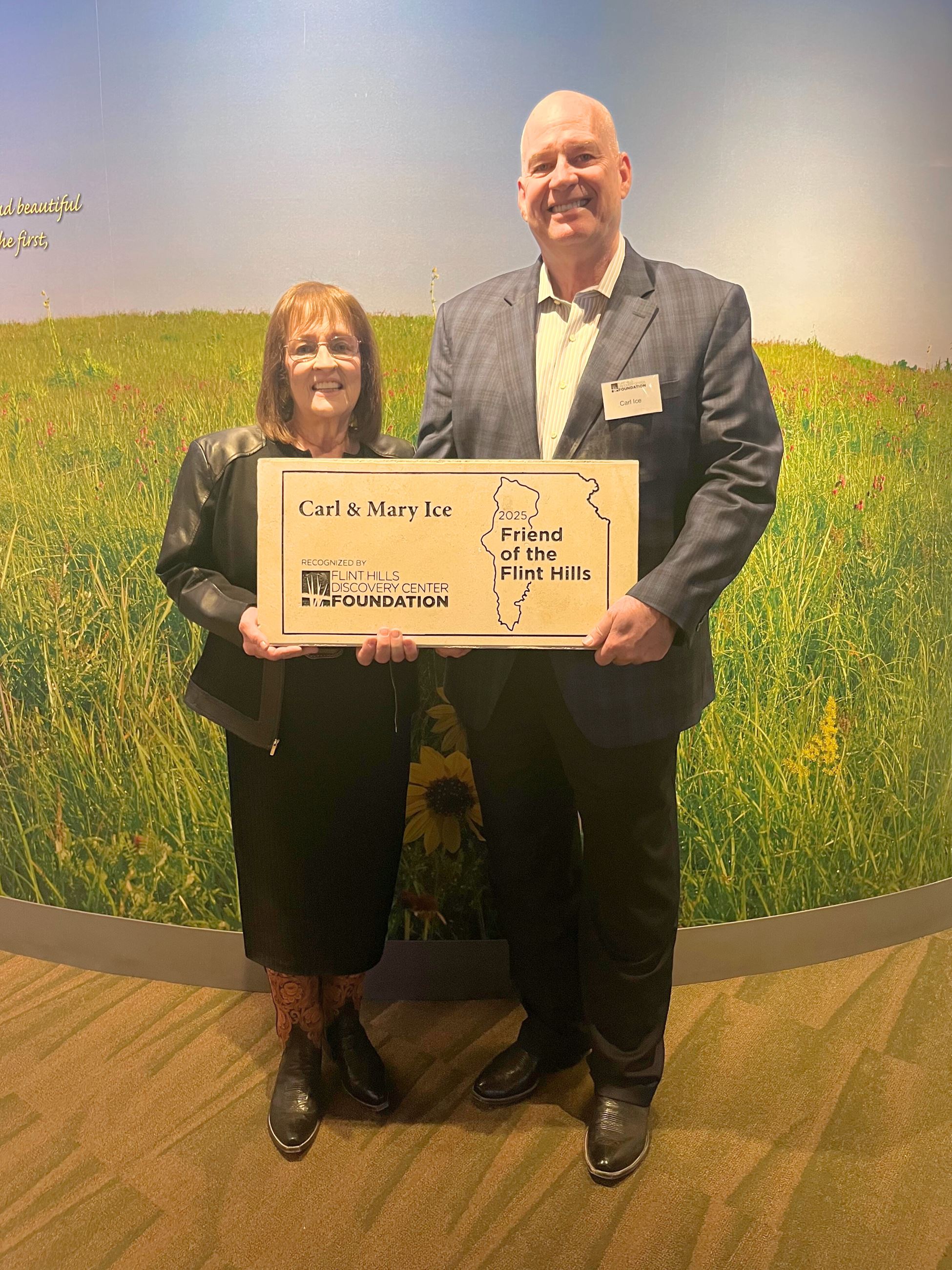 Carl and Mary Ice holding their Friend of the Flint Hills award rock